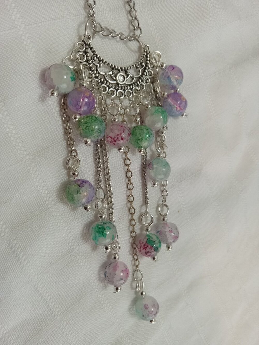 Exquisite handmade necklace featuring a half-moon-shaped Tibetan silver charm